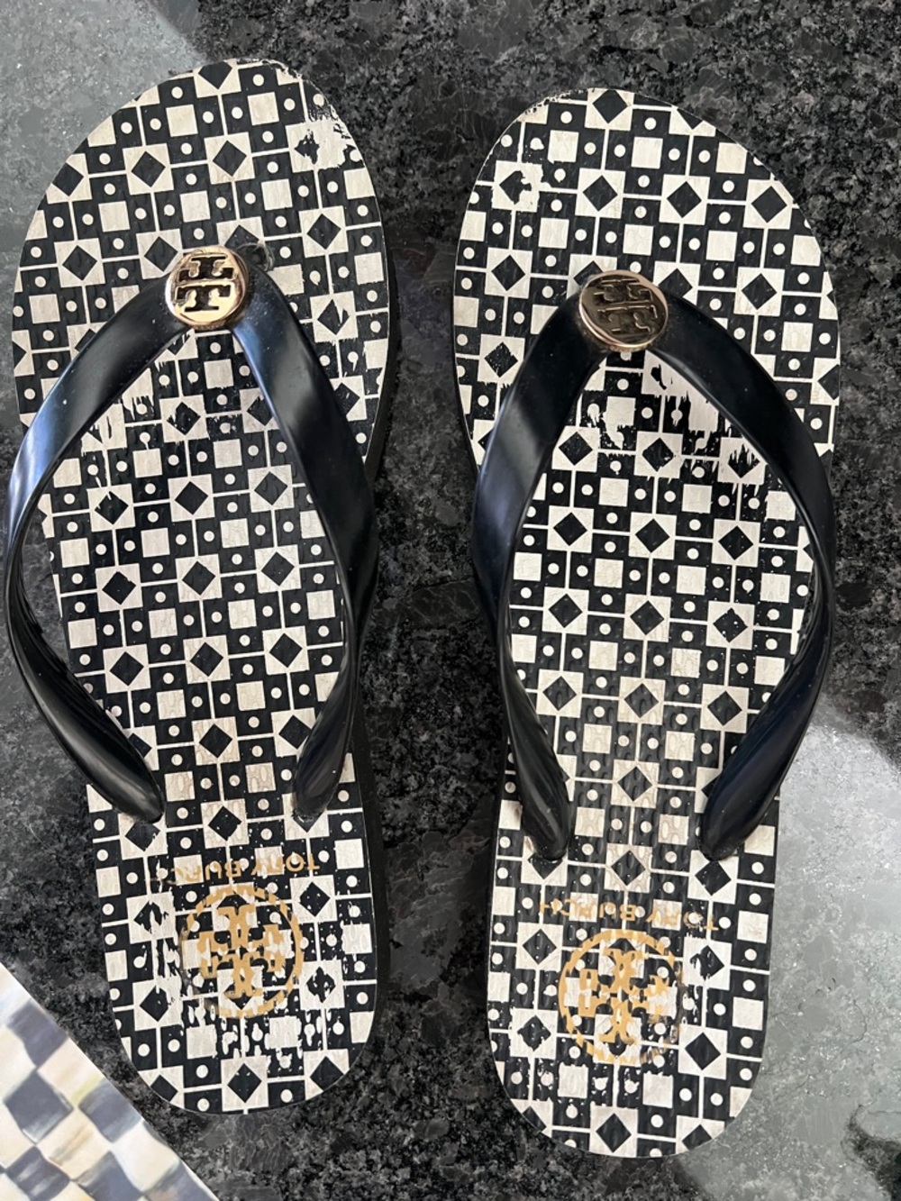 Tory Burch Black & White Geometric Logo Flip Flops with Gold Emblem